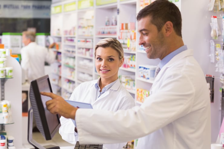 Team of pharmacists using computer at the hospital pharmacy-2